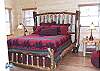 Master Bedroom has a Queen Size bed with gas fireplace and adjoining Master Bathroom with jacuzzi tub and tile walk in shower.