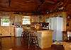 You only need to bring you groceries to prepare your gourmet meal in the fully equipped kitchen.  Watch TV and visit with your family and friends while cooking, or just sit quietly and enjoy the tranquil mountain view and watch the birds feeding on the porches.