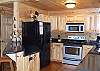 Fully Equipped Kitchen with Refrigerator, Oven/Stove, Microwave and Bar Seating for for 2