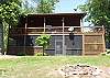 The cabins screened enclosure  pm the lower level provides a private area for the Hot Tub which is accessible from the Master Bedroom. The top deck has a covered porch which offers a gas burning fireplace to enjoy on those cool evenings. The Gas Grill is also located on the covered deck to prepare your family meals.
