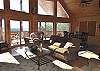 Enjoy the spacious Living Room situated around the woodburning fireplace