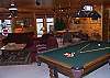 The family/game room has something for everyone.  Pool Table, game table which reverses to a Poker Table, 57"HDTV with HD, DVR, DVD, movie channels, and Home Theatre Surround Sound.