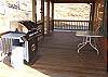 Gas Grill located on the covered porch just off the kitchen and living room.
