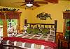 The Master Bedroom has a King Size Bed.  The French Doors opens to the wrap around deck with sitting area around the chimnea.  It  is also equipped with a 27" TV with DVD player for your enjoyment.  You can also enjoy a  private bath with rock shower is adjacent to the bedroom.