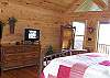The Master Bedroom  offers  Sattelite TV,  Master Bath with Jacuzzi Tub, Custom Tile Shower and Private Deck with beautiful Mountain View.