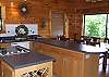 View of the kitchen bar area to the dining room area.  The large sliding glass door provides an excellent view of the mountains