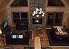 The living room and dining room is centered by the large stone faced fireplace with gas burning logs.