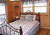 This bedroom has a Queen Bed and is one of 2 bedroom located on the main level of the cabin.