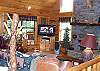The Living Room is situated around the gas log fireplace and the LCD TV