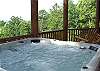 Enjoy the 6 person Hot Tub or just relax in one of the many rocking chairs from the decks of the cabin.