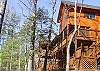 Side View of the Many Decks.  The large screened deck provided a large table for your evening meals or playing cards.