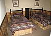 One Twin Bed and one Full Bed are placed in the Lower Level Bedroom