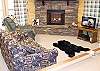 Enjoy the warmth of the gasburning fireplace while playing a game of pool or watching TV in the inviting family room.