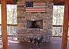 While grilling your favorite meal you can enjoy the warmtn of the wood burning fireplace on the covered deck.