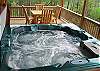 On the Lower Deck of the Cabin you can swing in the Porch swing, picnic at the Table, or just soak your cares away in the 6 person Hot Tub.