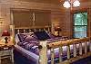King Size Log Bed with adjoining bathroom located on the on Main Floor Level