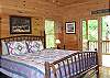 King Bed made with Mountain Laurel Wood is located in the Master Bedroom with access to private deck overlooking the crreekview