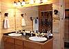 The bathroom on the Main Level is located across the hallway from the bedroom and provides a tub shower.