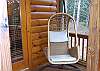 Enjoy the Rattan Swing located on the private screened porch off the Master Bedroom