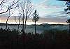 What a breathtaking view from the decks of the cabins.  This is a wintry morning with the fog ligting from the valley.  At nighttime you will enjoy watching the Moon Rise over the Mountains and open up a star filled sky.  This peaceful outdoor awaits you from the decks of Southern Star.