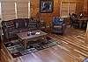 Leather Couches centered around the Woodburning Fireplace in the Living Room