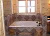 Jacuzzi Tub with Tile walk in shower in the Master Bathroom