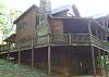Covered Porches amd open decks on this beautiful cabin for your enjoyment.   The top deck is a private deck from the Master Bedroom. Hot Tub is located on the lower patio with easy access to a nature trail for the adventurous.