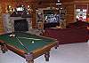 In the family/game room you can also enjoy the warmth of the gas log fireplace as you play a game of pool or enjoy your favorite TV show or Sport Event on the 57" HDTV.