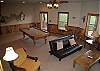 View of the family room shows the futon which would provide extra sleeping.