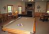 View of the Game Room from the Pool Table to the Gas Burning Fireplace.