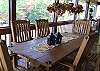 French Doors open to the awesome screened porch and mountain breezes.  You can enjoy extra seating for 6 more guests at the outdoor dining table.