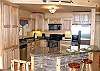Fully Equipped Kitchen with Stainless Steel Appliances, Stove/Oven, Microwave, Dishwasher.