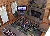 View of the Living Room from the Loft area.  The  furniture is centered around the Gas Burning Fireplace and LCD TV
