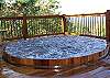Enjoy an Awesome Mountain View while relaxing in the Cedar Sunken Hot Tub.
