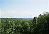 Enjoy the long range mountain view from the back deck of the cabin