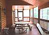 The large screened porch provides area for outdoor eating or playing games with your family or just enjoying the beauty of the outdoors, sitting in the rocking chairs.