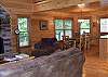 View of the living room to the dining room of the cabin.