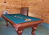 The game room is located adjacent to the cabin. You can enjoy a game of pool or place the Ping Pong table on top of the table for another game.