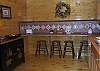 The kitchen has extra seating for 4 at the bar area.