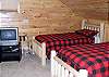 The loft bedroom has 4 twin beds with TV/DVD Player