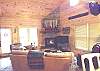 Enjoy relaxing in the living room around the Flatscreen TV or Gas Log Fireplace with your family.