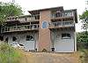 Half of a duplex nestled among trees high on a hill with great ocean views!
