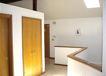 Front door entrance to stairway and upstairs hall