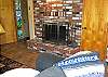 Lower Level Living Room with Entry Door Standing Open
