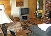 TV, Wood Burning Fireplace, Entry Door Standing Open