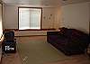 TV in this room is for GAMES only.  Stairway at back on right to main floor.  Hot tub + bunk room accessed from this room.
