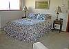 Large, open queen bedroom on upper level