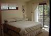 Enjoy the small balcony off this main level queen bedroom.