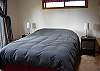 There is a small deck to the left off this main level queen bedroom.