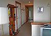 Open Door to Upstairs Bedroom. Stairs Down Opposite Coat Rack